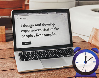 Laptop with the an alarm clock and the words I design and develop experiences that make people's lives simple