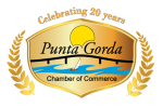 Logo of the Punta Gorda Chamber of Commerce. It features a shield with a sunset, bridge, and sailboat. "Celebrating 20 years" is written above, with golden laurel branches on each side.